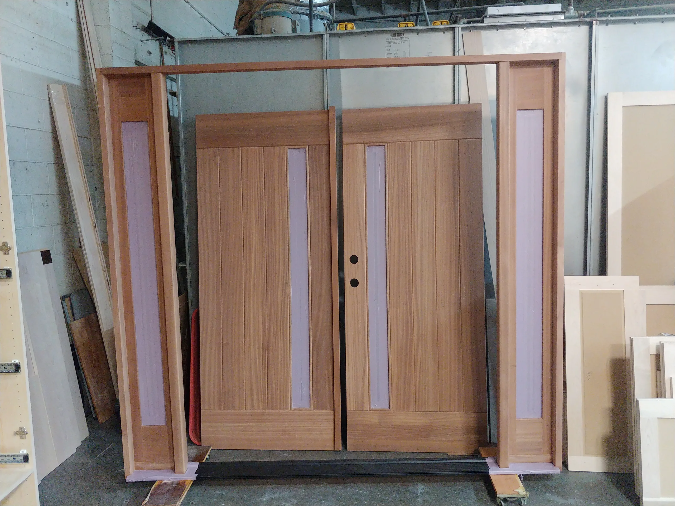 Custom entry doors with sidelights and complete door jamb in natural oak